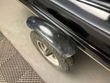 a close up of a tire on the side of a car