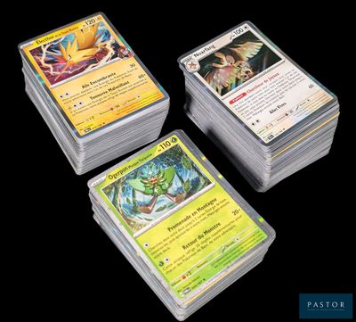 three decks of pokemon cards sitting on top of each other