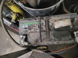an old car battery that is sitting on the ground