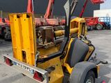 a picture of a yellow crane with a sign on it