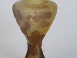 a glass vase with a floral design on it