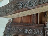 a bed that has a wooden headboard on top of it