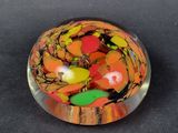a glass ball that has a lot of different colored beads in it