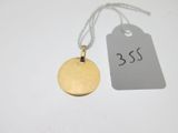 a gold disc with a price tag attached to it