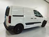 a picture of a white van parked in a garage
