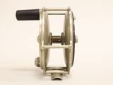 a close up of a fishing reel on a white background