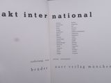 an open book with the words akt inter national written on it