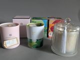 a cup of tea next to a container of tea and a box of tea