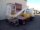 a white truck with a crane on the back of it