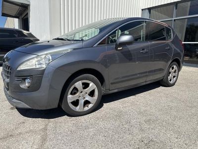 the grey car is parked in front of a building