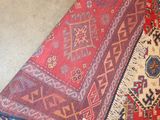several rugs are laid out on the floor in a room