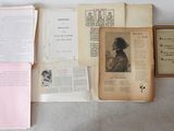 many old books on the table with pictures on them