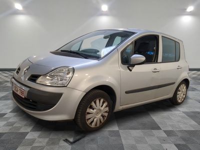 a picture of a small silver car parked on a checkered floor