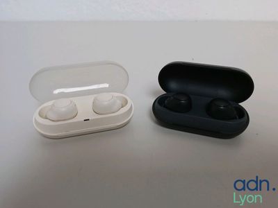 two airpods sitting next to each other on a table
