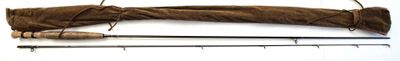 a piece of hair that is next to a pair of knitting needles