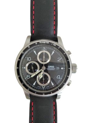 men ' s watch with black dial and red stitching on a black leather strap