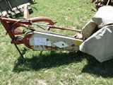 a rusted bike with a bag on the back of it