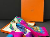a pink, blue and green scarf and a orange box