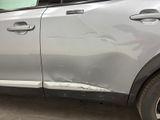 a car that has been dented and is parked in a garage