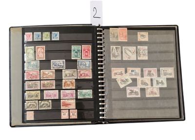 a black binder with a lot of stamps on it