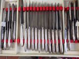 a lot of knives in a box on the table