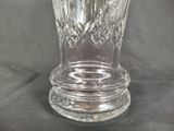 a glass vase that is sitting on a table
