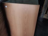 a wooden cabinet with a glass top in a room