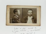 an old photo of two men in suits and ties with a handwritten note in front of them