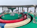 a toy carousel with a horse and a man on it