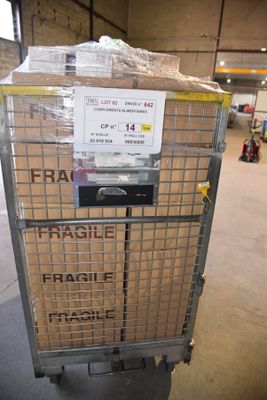 a cart that has a lot of boxes on it