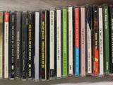 a lot of cd ' s that are stacked up together
