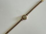an image of a wrist watch on a white surface