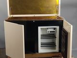 a small refrigerator that is open on a dolly