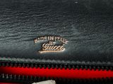 an image of a close up of a black and red purse