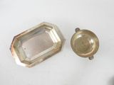 a small silver plate and a small silver plate
