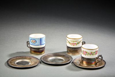 four cups and saucers sitting on a table