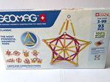a box with a set of geometric toys in it