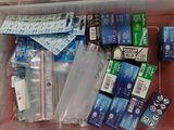a plastic container filled with many different types of electronic gadgets