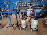 two large metal tanks sitting on top of a table