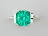 an emerald and diamond ring