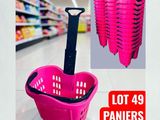 a picture of a pink shopping basket with a black handle