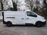 a white van that is parked in a parking lot