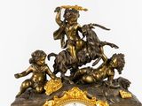 a clock that has a statue of a woman on a horse
