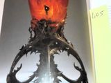 an open book with a picture of a candle on it