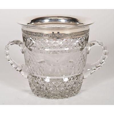 a silver plated glass ice bucket with handles and handles