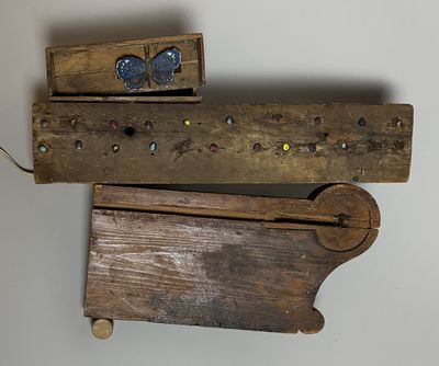 a wooden box with a butterfly on it and a wooden box with a butterfly on it