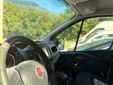 a car with a steering wheel and a car seat in it