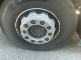 a close up of a tire on the side of a truck