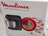the box is open to show the contents of a food processor