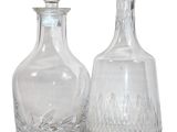 pair of clear glass decanters on a white background